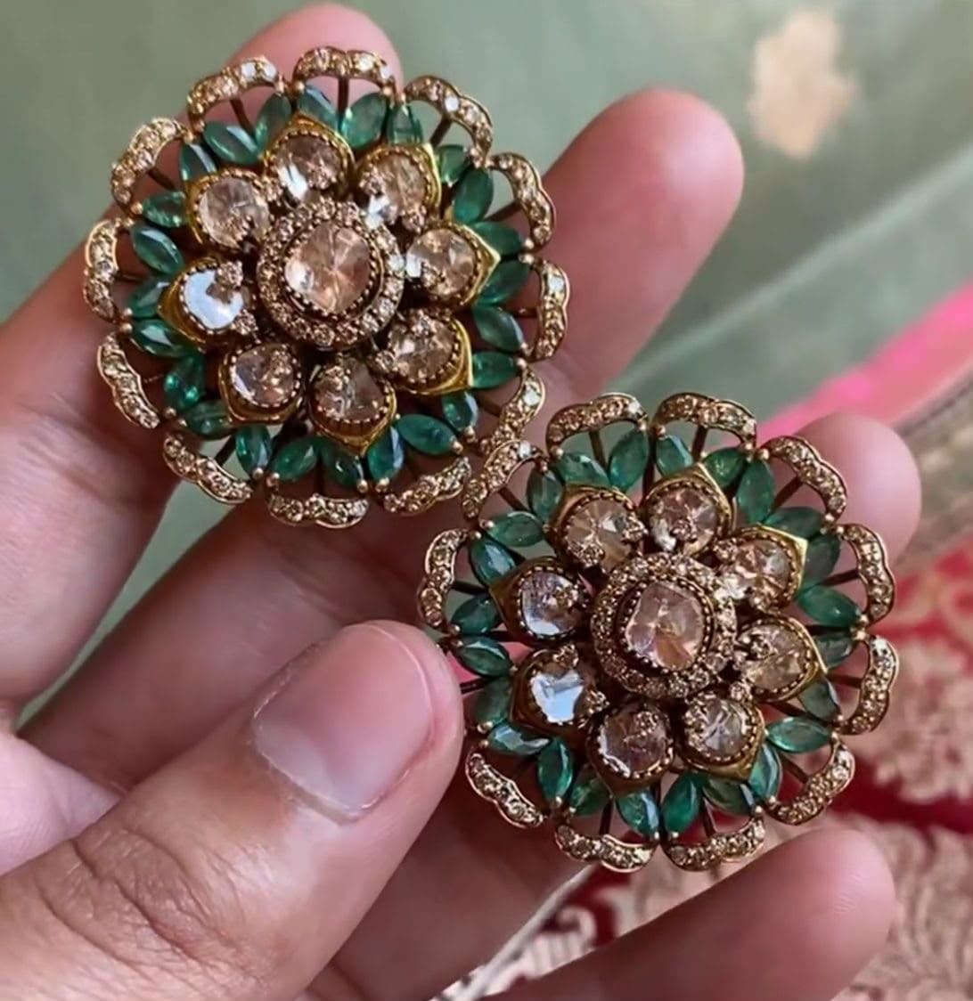 Emerald Bloom — Green marquise petals turning outward from a warm uncut centre.
