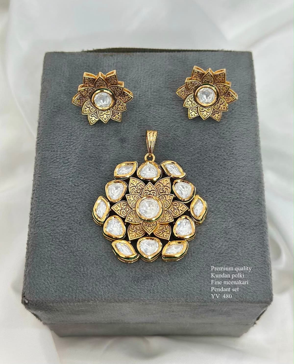 Kundan Bloom — A flower opening twice over — engraved petals inside, uncut stones around, matched to a pair of studs.