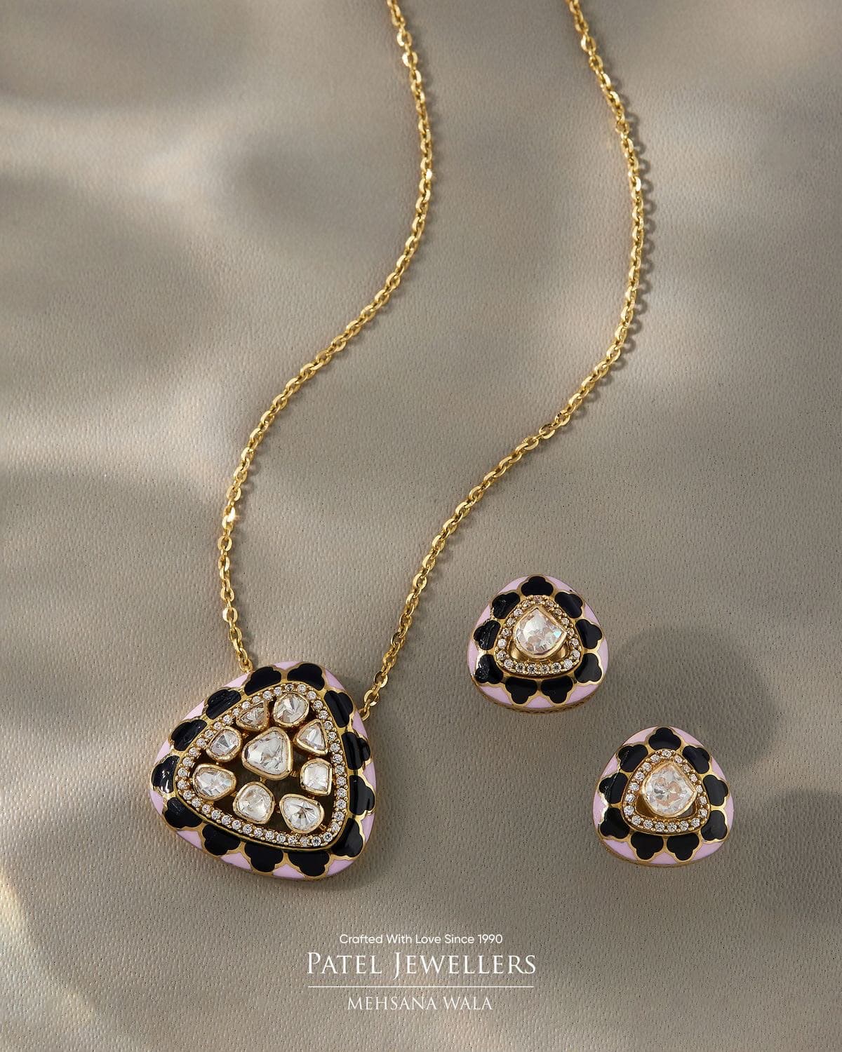 Meenakari Blush — Pale pink and black enamel curved around a cluster of uncut stones.