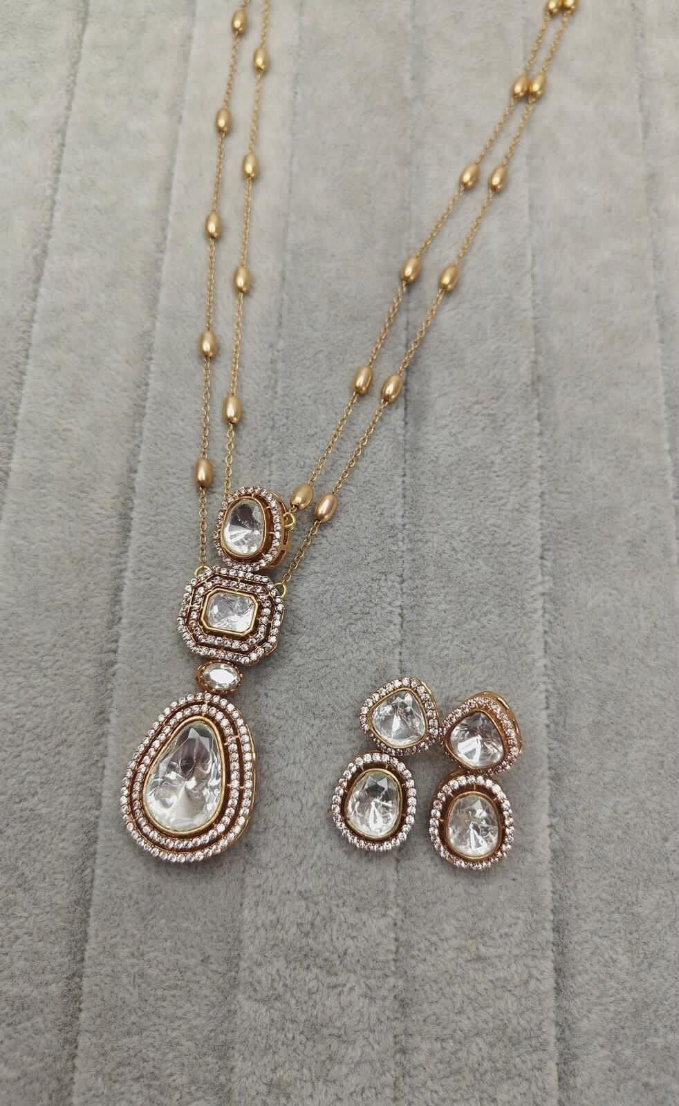 Polki Cascade — Three uncut stones falling in scale down a beaded chain, with studs cut to match.