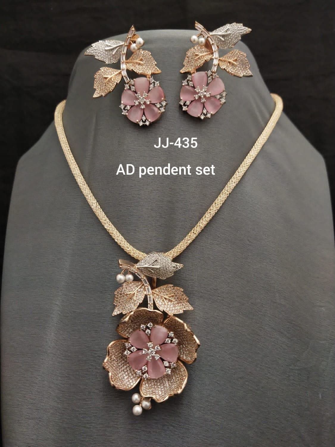 Rose Blossom — A full flower in rose gold with leaves, pearls and a run of small stones.